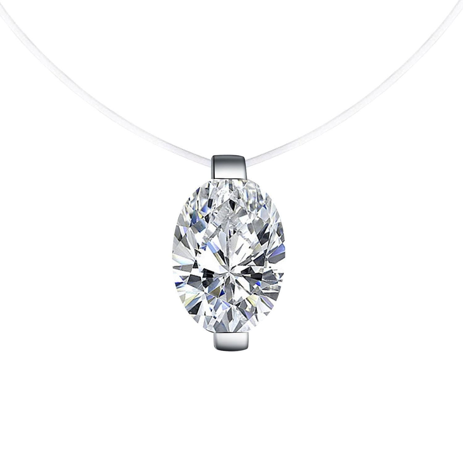 Jewelry featuring an oval-cut gemstone necklace centered against a minimalist white studio background with a multi-faceted clear brilliant stone held by silver-tone metal clasps on a thin transparent illusion cord