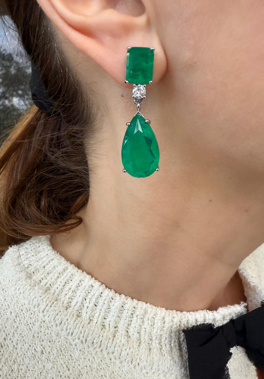 Close-up of a person wearing green teardrop earrings  - Ali & Eve Jewels