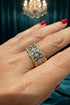 Gold and silver ring on a hand with a blurred outdoor background - Ali & Eve Jewels