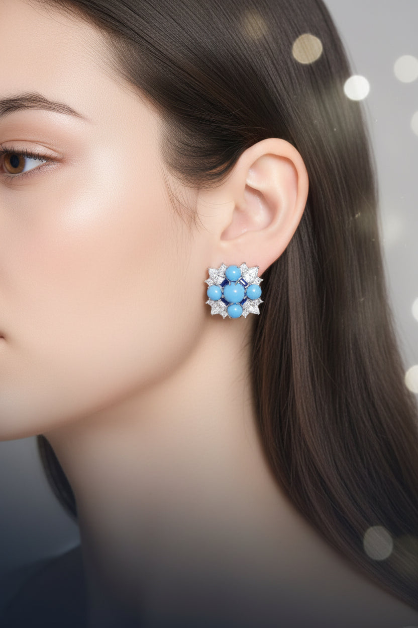 Close-up of a person wearing a blue gemstone earring - Ali & Eve Jewels