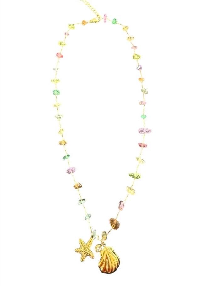 Handcrafted gold-wire necklace on a white background featuring a strand of multicolored irregular gemstones and two nautical charms including a textured starfish and a polished golden seashell