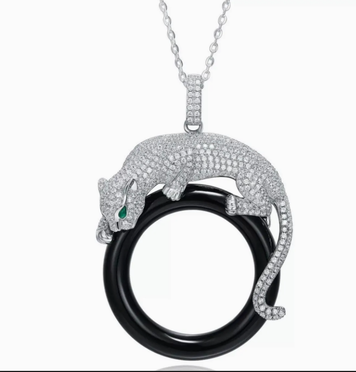 Jewelry pendant with panther design on a white background