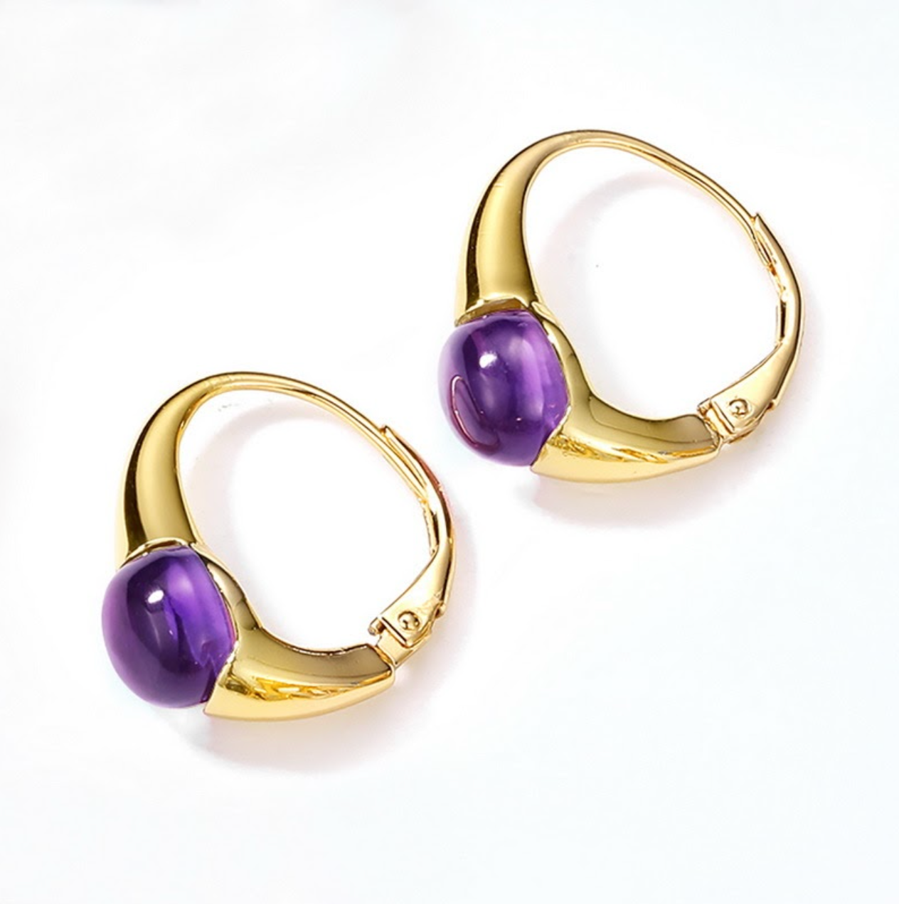 Gold hoop earrings with purple gemstones on a white background  - Ali & Eve Jewels