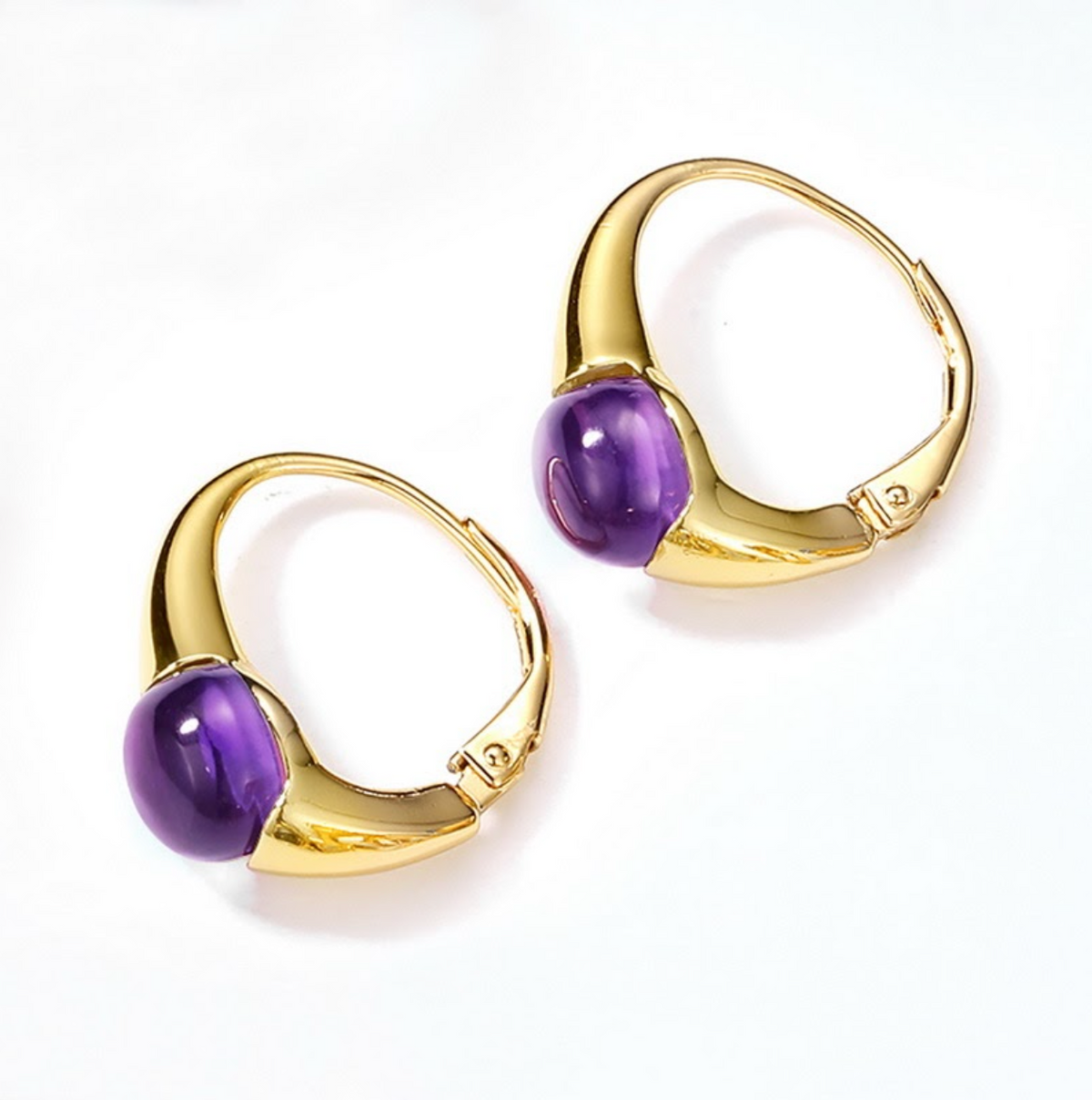 Gold hoop earrings with purple gemstones on a white background  - Ali & Eve Jewels