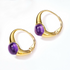 Gold hoop earrings with purple gemstones on a white background  - Ali & Eve Jewels