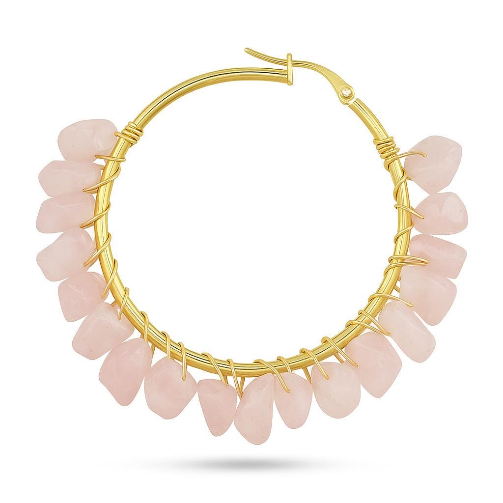 Gold wire and rose quartz jewelry hoop earring featuring tumbled pink gemstone nuggets secured with decorative gold wire wrapping along a circular frame on a white background