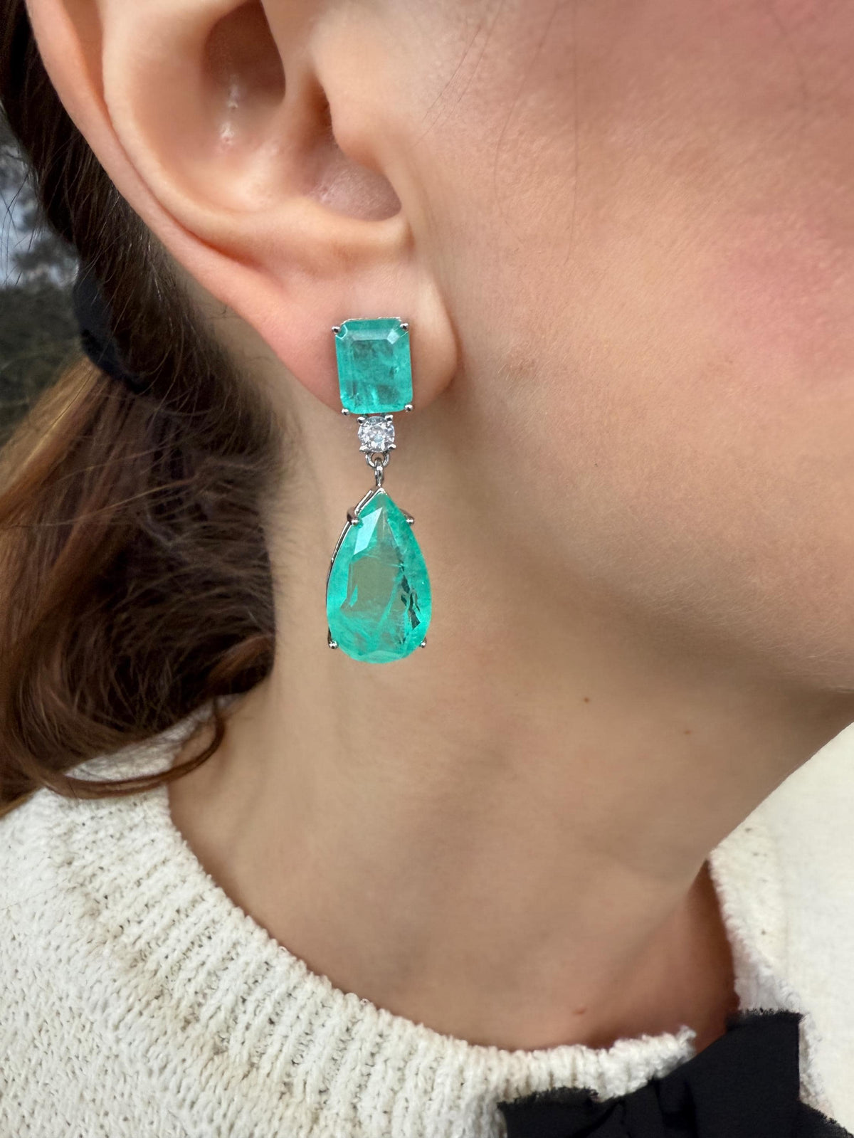 Close-up of a person wearing turquoise drop earring- Ali & Eve Jewels