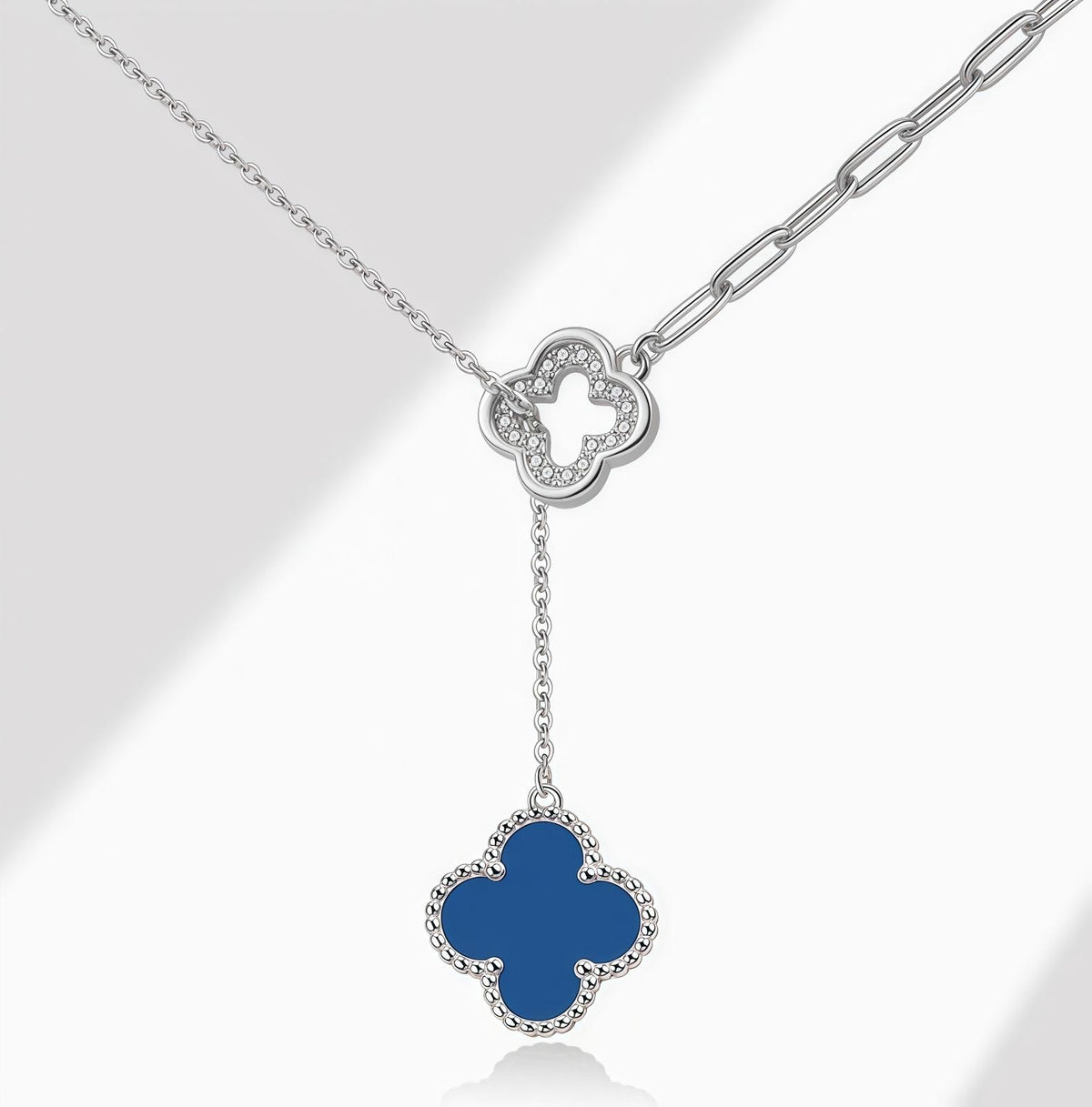 Silver Necklace with blue agate clover-shaped pendant on a white background