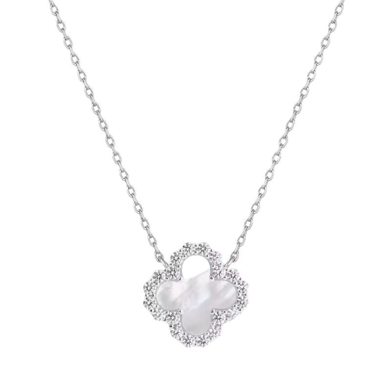 Van Cleef & Arpels white gold necklace showcasing an iconic Alhambra clover pendant with an iridescent white mother-of-pearl center and a sparkling pavé diamond border on a delicate cable chain
